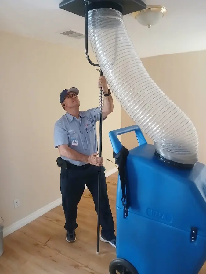 Mini Split Installation technician using HEPA equipment in Economy